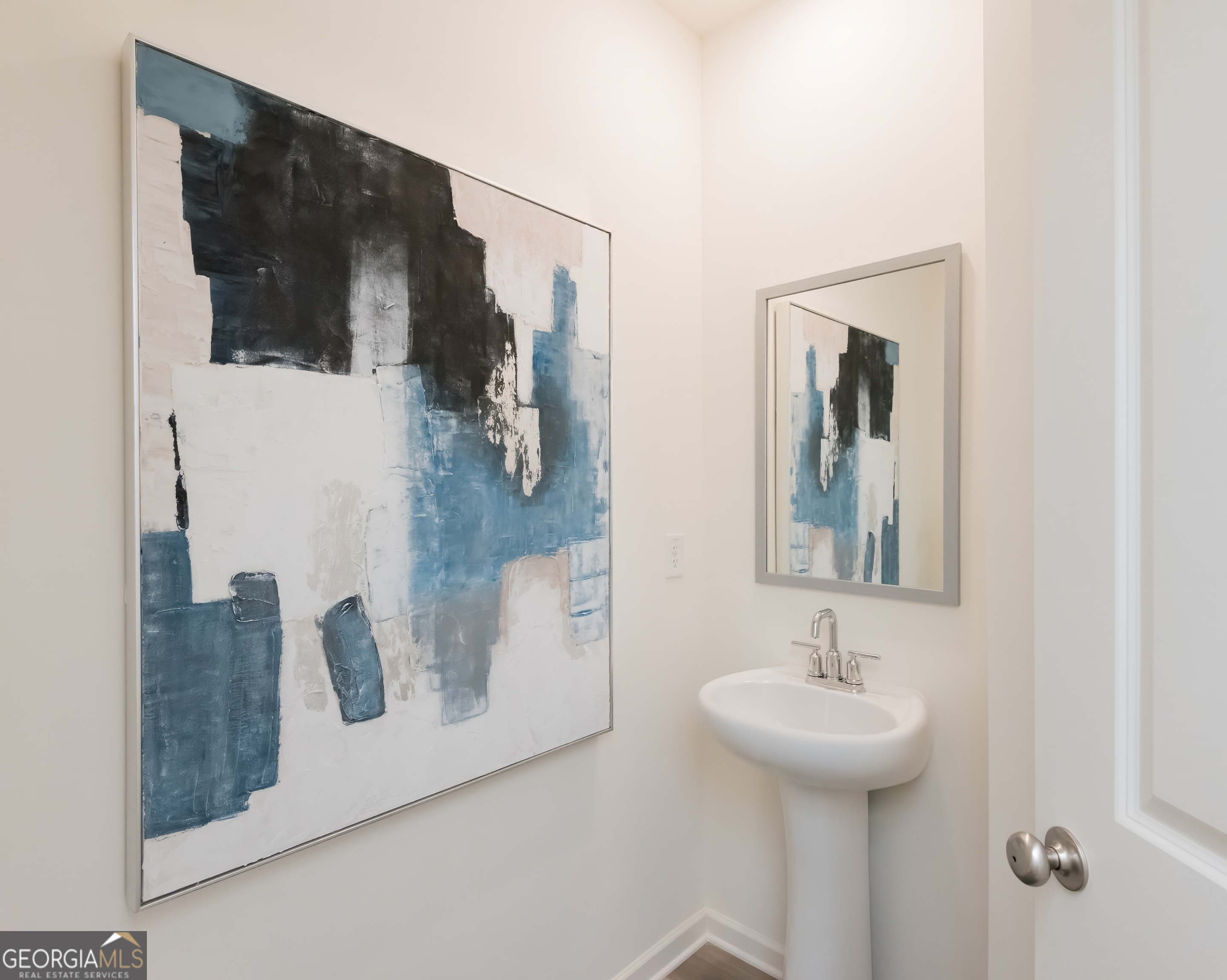 2553 Riverside Court Northeast Conyers, GA 30013 - Photo 5 of 40 a bathroom with a sink and mirror