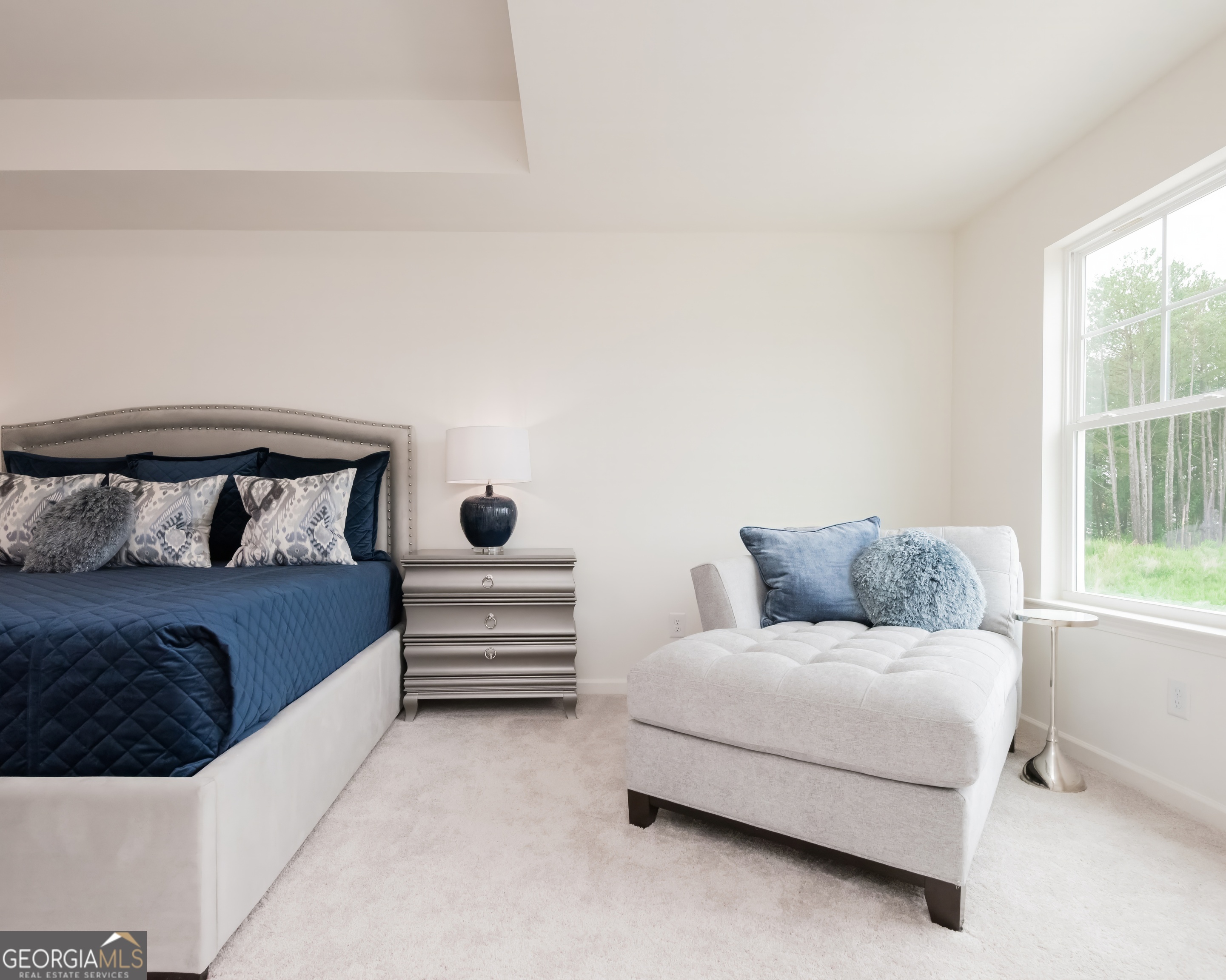 2553 Riverside Court Northeast Conyers, GA 30013 - Photo 10 of 40 a bedroom with a bed and window