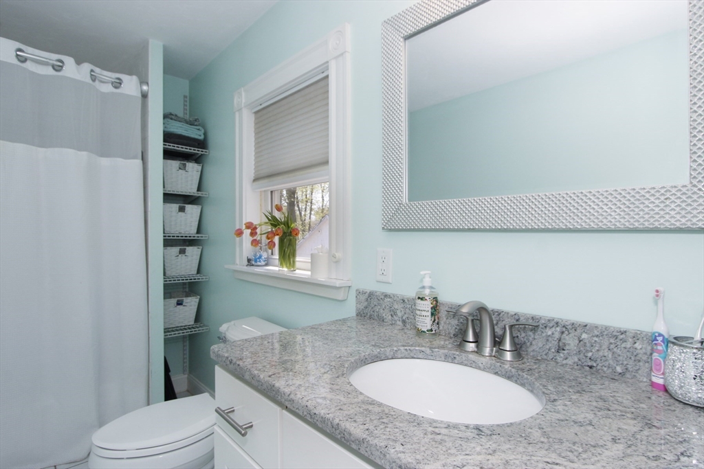 2 High Street Middleboro, MA 02346 - Photo 13 of 41 a bathroom with a granite countertop sink toilet and a mirror
