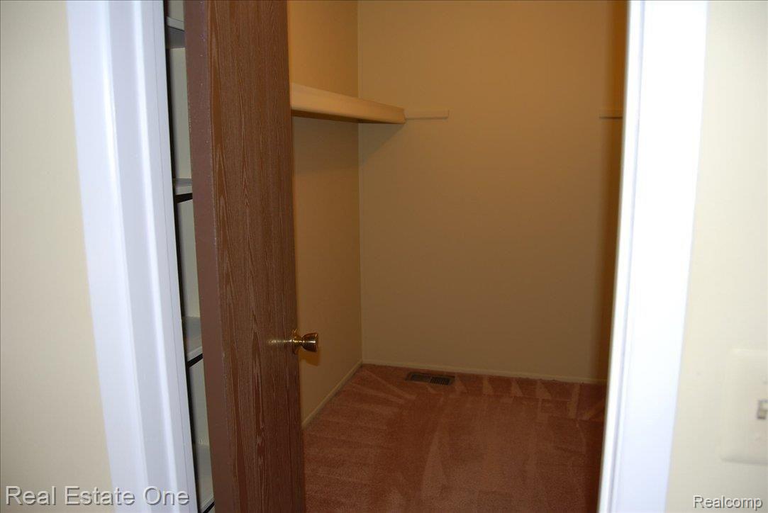 1865 Christy Court, Unit 202 Rochester, MI 48309 - Photo 14 of 19 Large Master Walk-in Closet