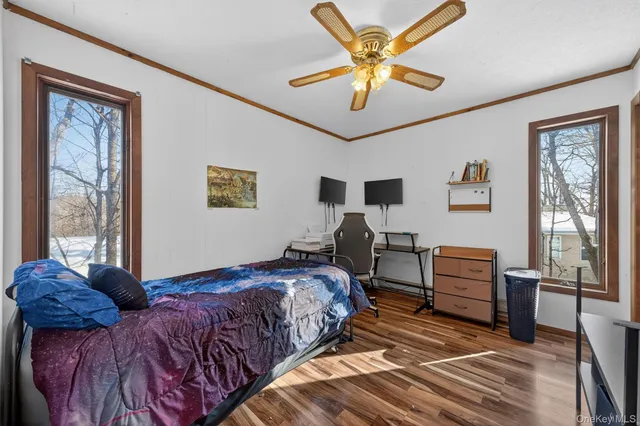 a bed room with a bed and a television