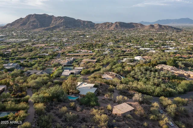 a view of a city with mountains in the background