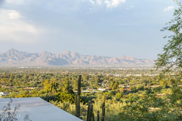 a view of a city with mountains in the background