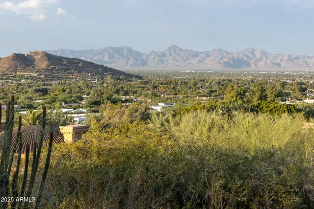 a view of a town with mountains in the background