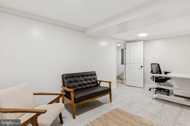 a spacious bathroom with a granite countertop sink and a mirror