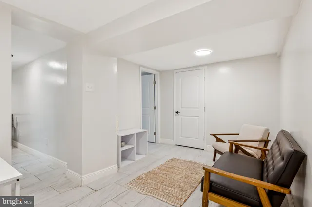 a bedroom with a bed and with a potted plant