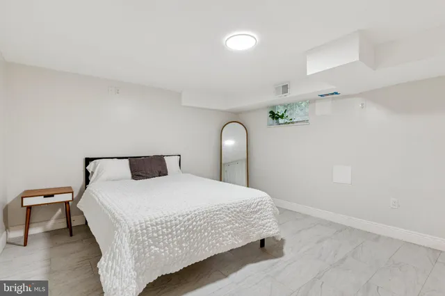 a bathroom with a sink a mirror and a toilet