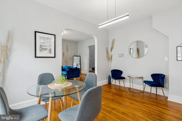 a living room with furniture and a chair