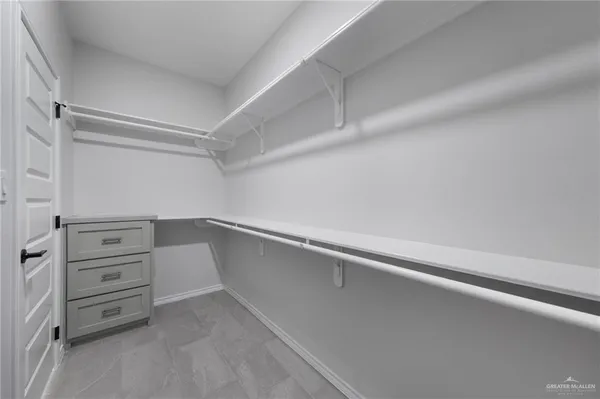 a view of an empty walk in closet