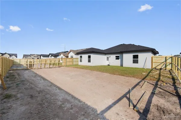 a house with trees in the background