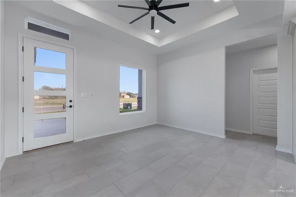 a view of an empty room with a window