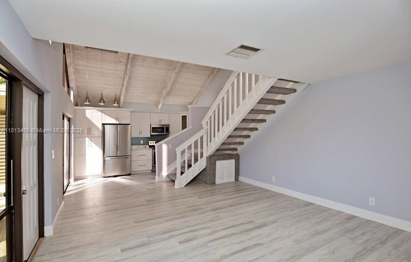 1605 Highway 1, Unit 10H Jupiter, FL 33477 - Photo 16 of 31 a view of entryway and hall with wooden floor