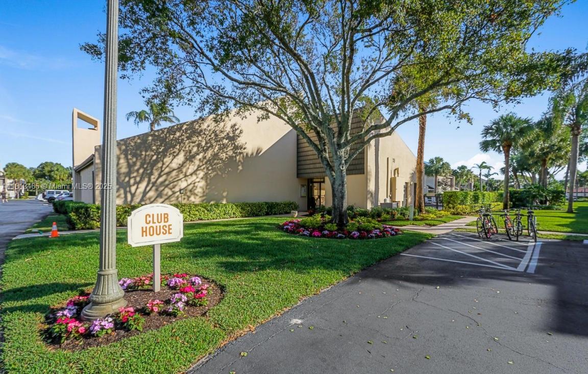 1605 Highway 1, Unit 10H Jupiter, FL 33477 - Photo 27 of 31 a front view of a building with garden