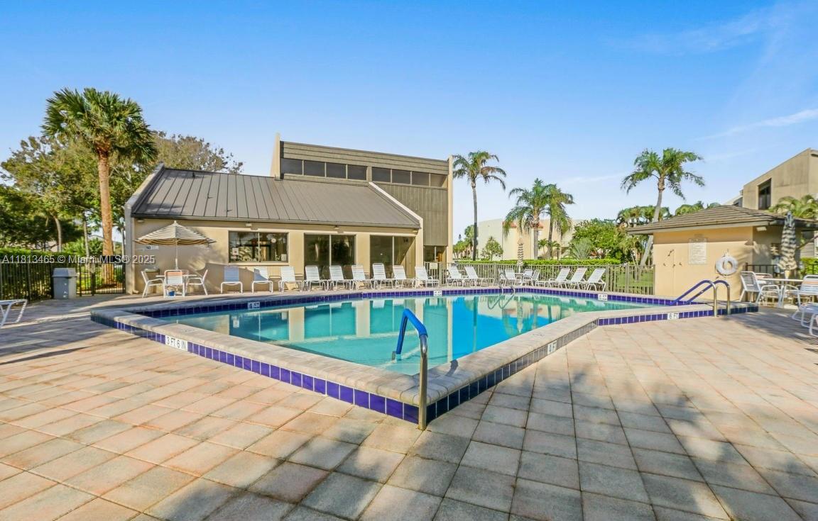 1605 Highway 1, Unit 10H Jupiter, FL 33477 - Photo 29 of 31 a view of swimming pool with chairs