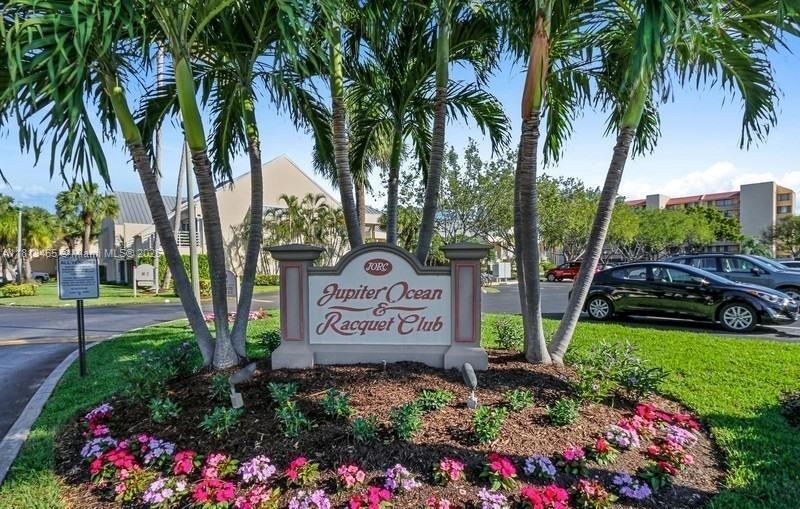 1605 Highway 1, Unit 10H Jupiter, FL 33477 - Photo 30 of 31 a sign on the side of the park