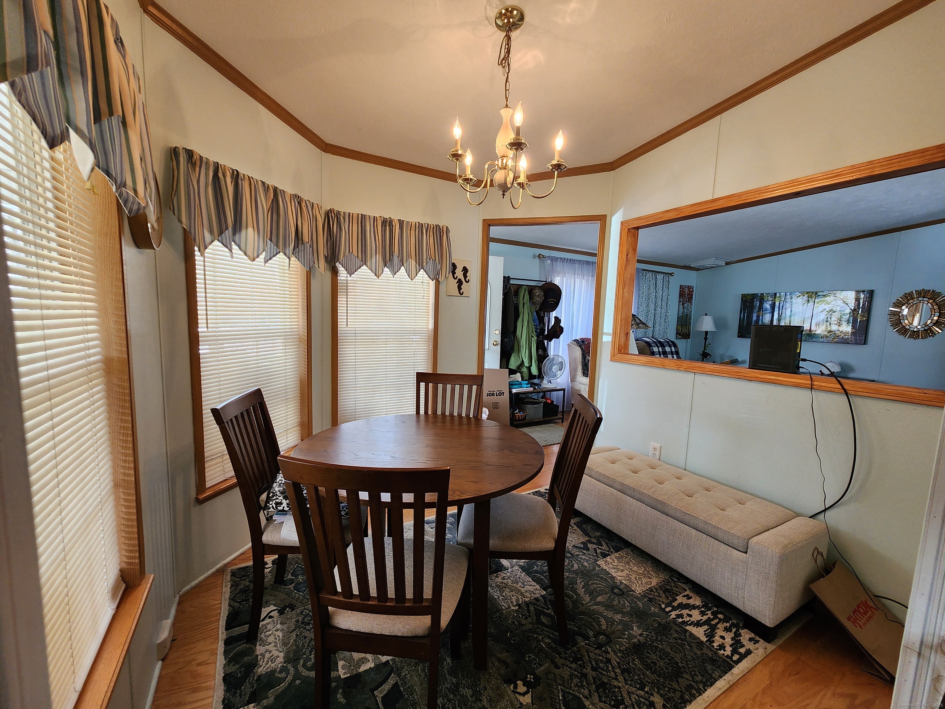 43 Evergreen Park Clinton, CT 06413 - Photo 12 of 43 a view of a dining room with furniture and a chandelier