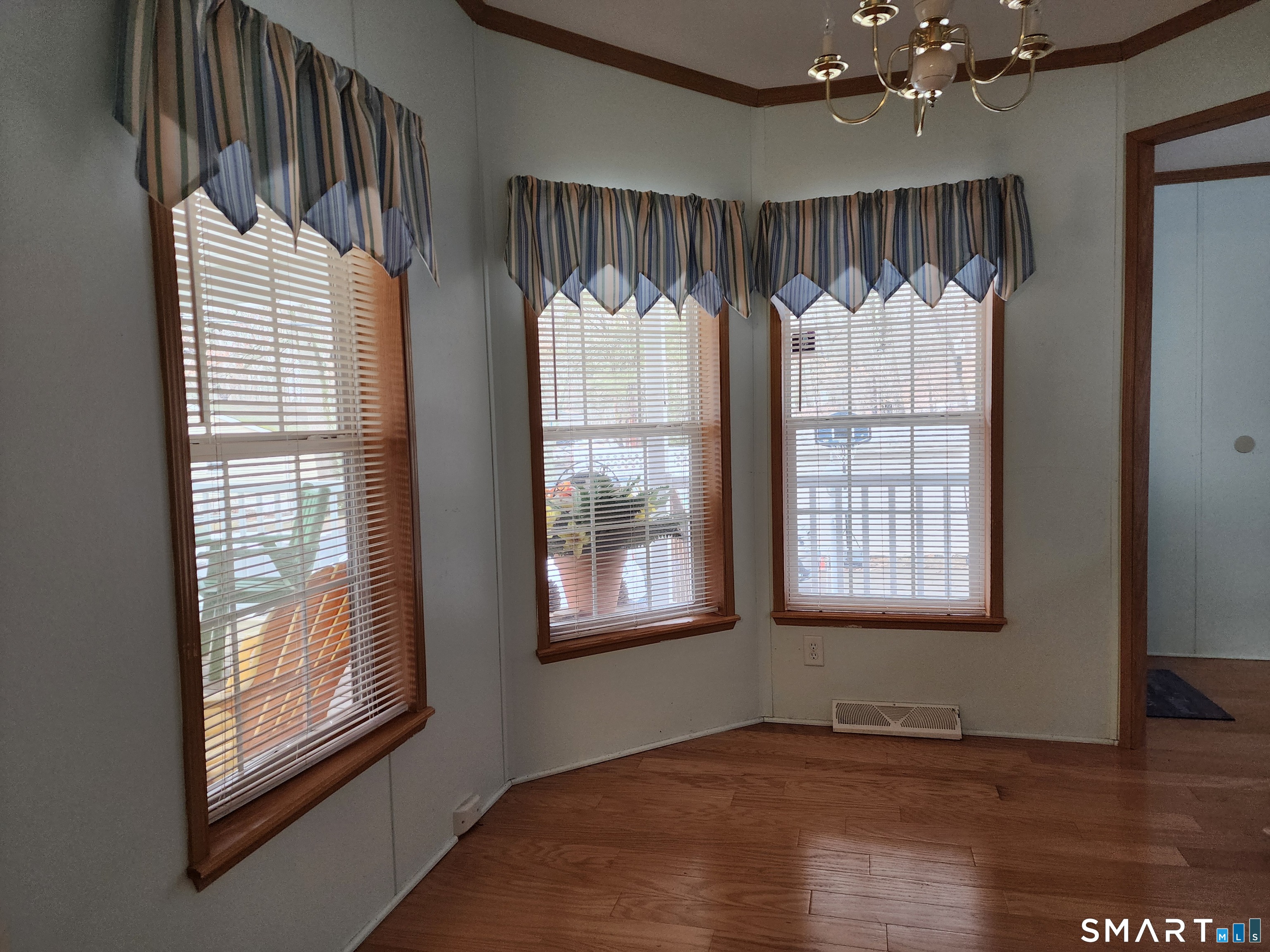 43 Evergreen Park Clinton, CT 06413 - Photo 15 of 43 an empty room with wooden floor and windows