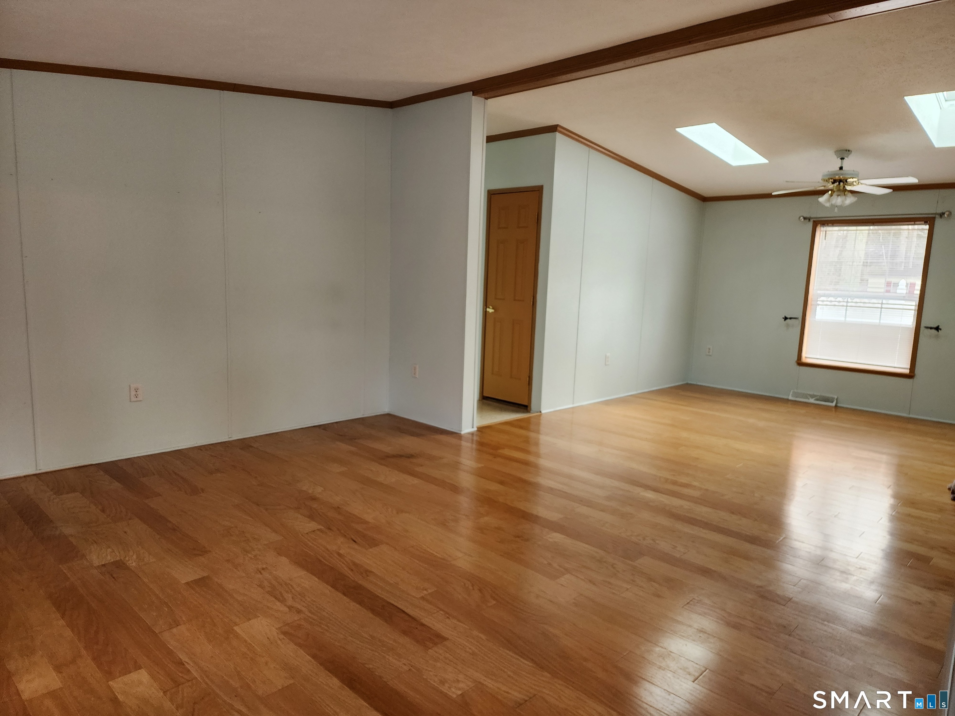 43 Evergreen Park Clinton, CT 06413 - Photo 19 of 43 an empty room with wooden floor and windows