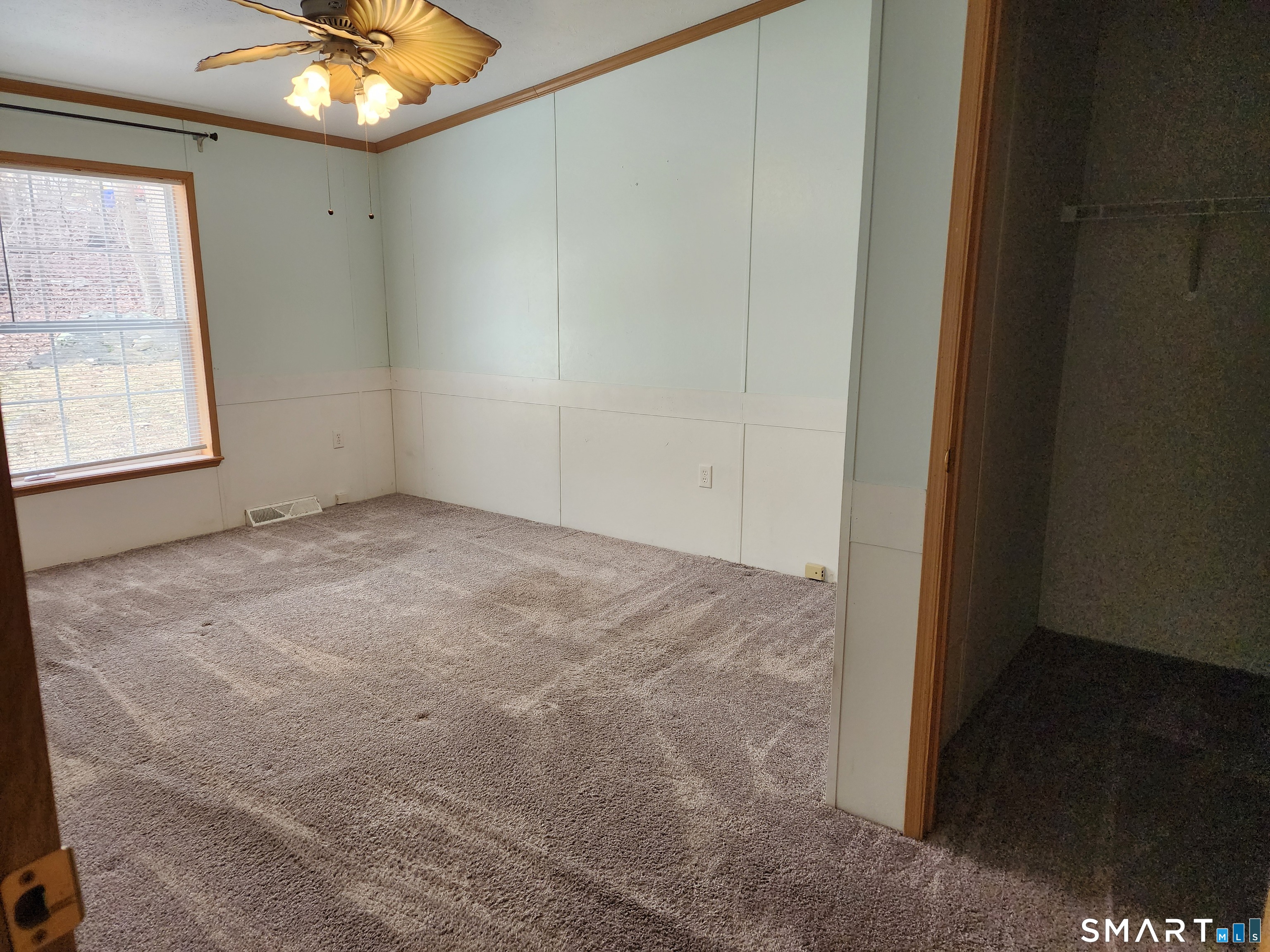 43 Evergreen Park Clinton, CT 06413 - Photo 25 of 43 en empty room with window and chandelier fan