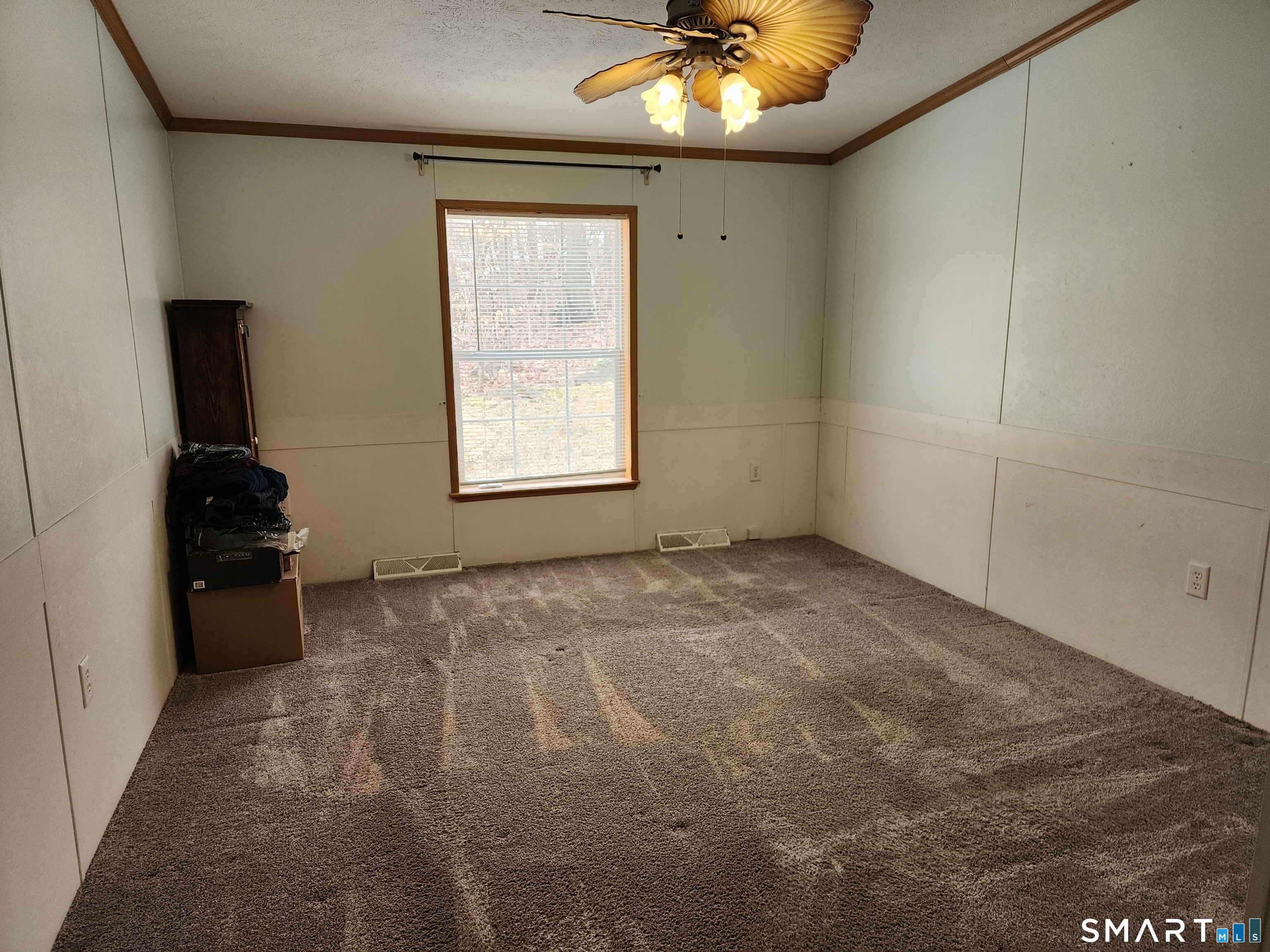 43 Evergreen Park Clinton, CT 06413 - Photo 27 of 43 an empty room with a chandelier fan and windows