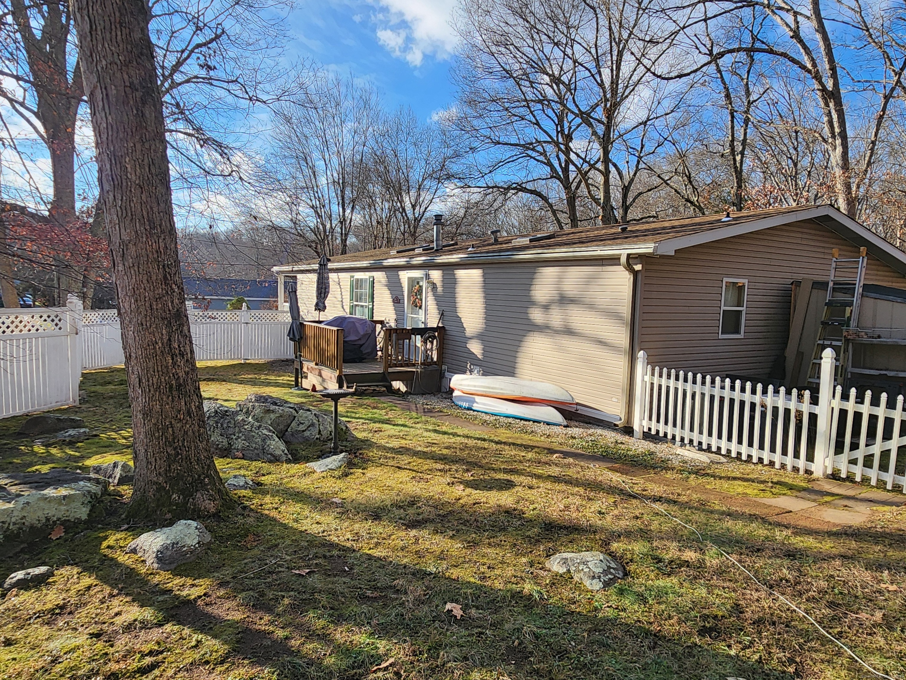 43 Evergreen Park Clinton, CT 06413 - Photo 32 of 43 a view of a house with a yard covered in snow