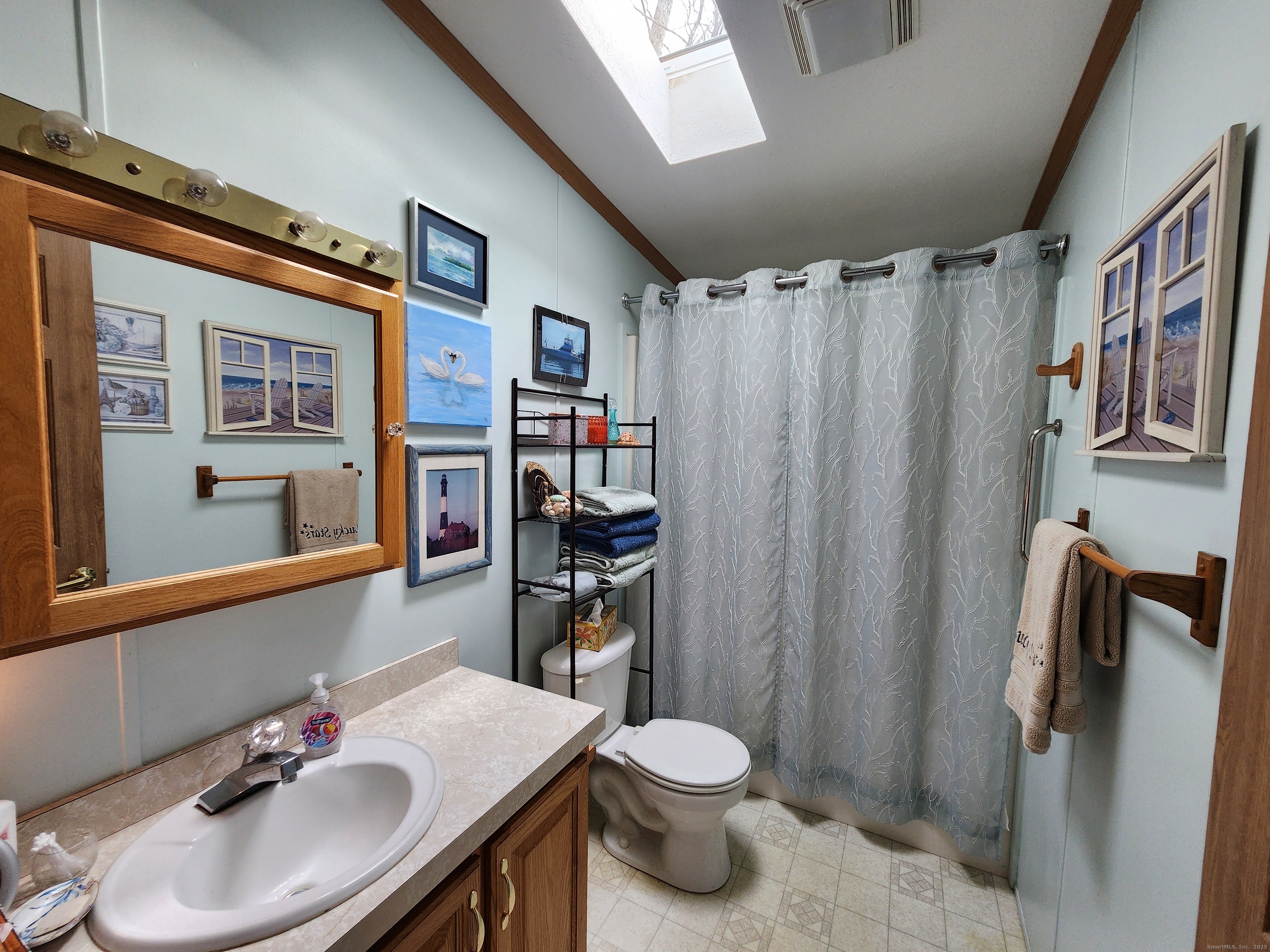 43 Evergreen Park Clinton, CT 06413 - Photo 40 of 43 a bathroom with a sink toilet and shower