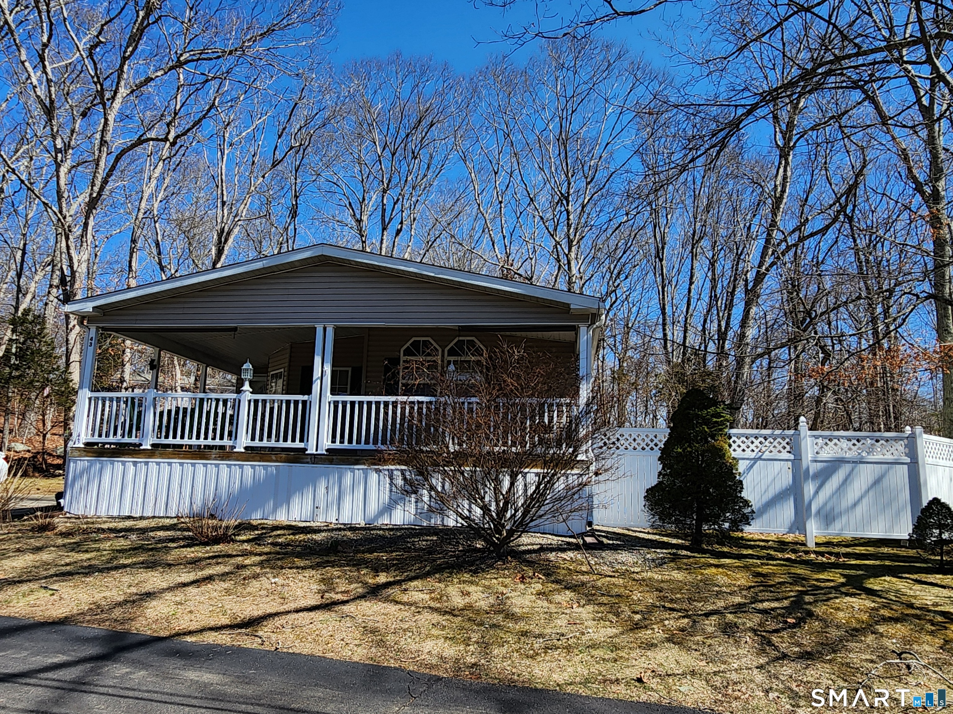 43 Evergreen Park Clinton, CT 06413 - Photo 4 of 43 a view of a house with wooden deck
