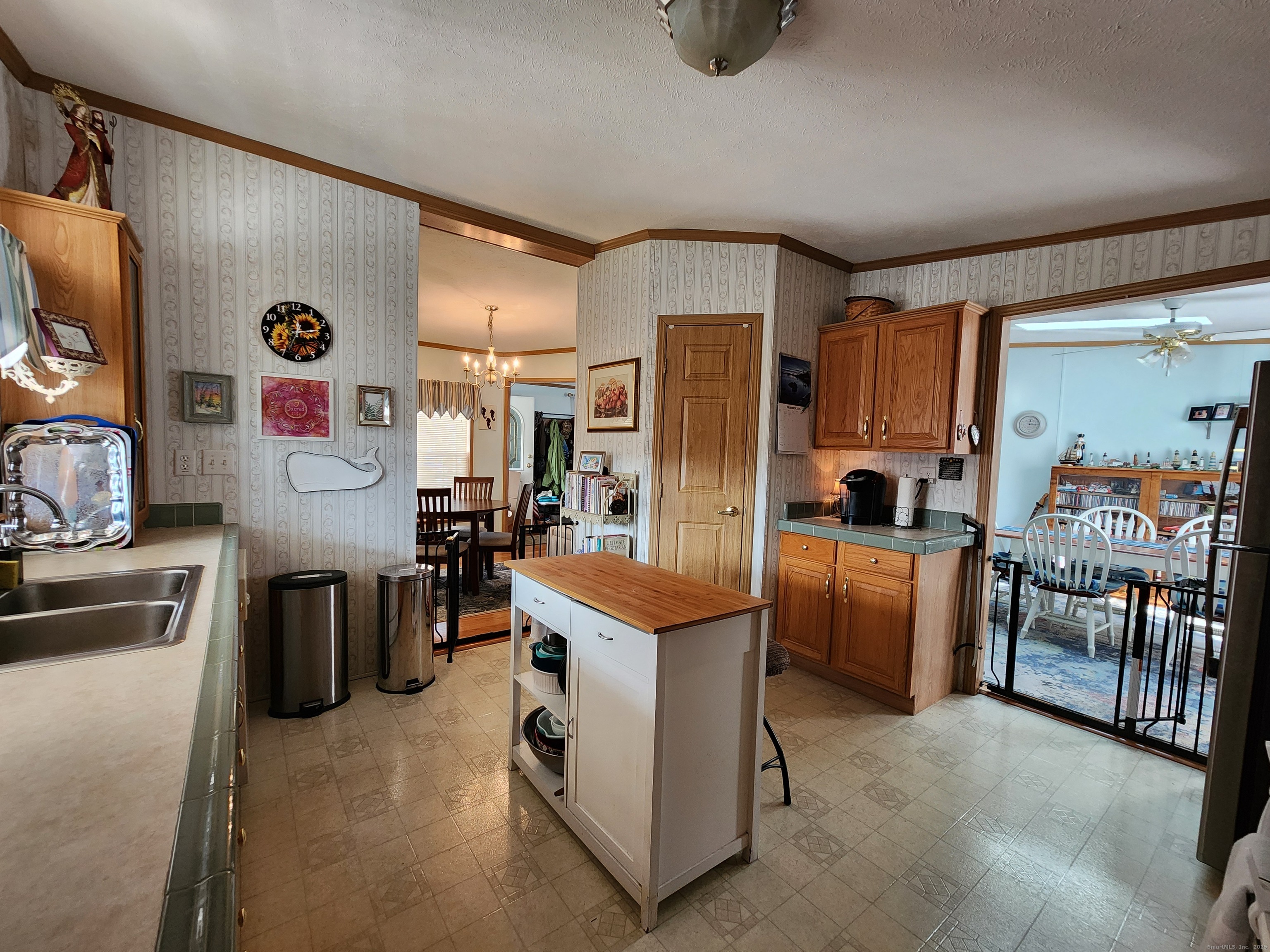 43 Evergreen Park Clinton, CT 06413 - Photo 7 of 43 a room with furniture a refrigerator and a sink
