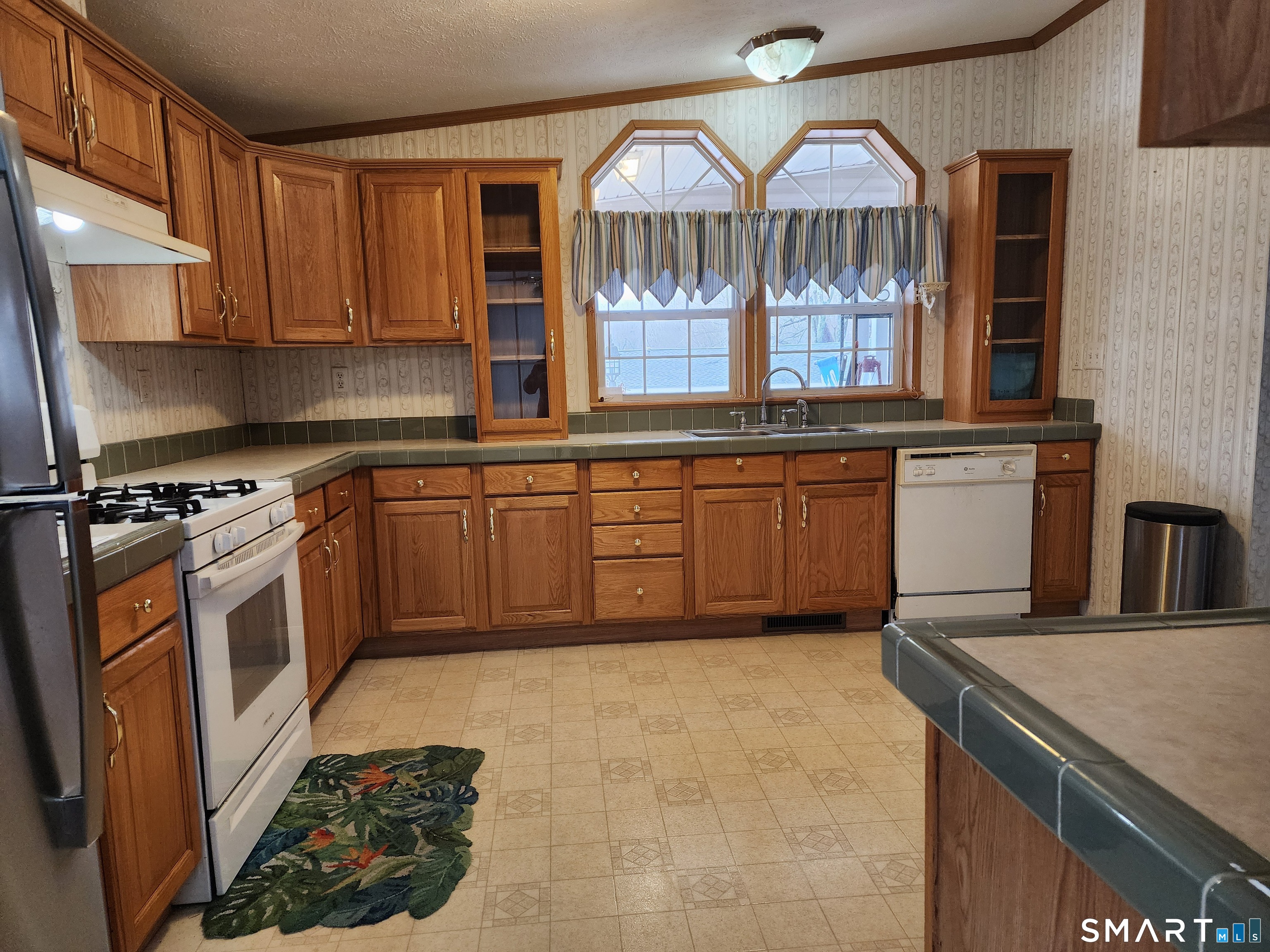 43 Evergreen Park Clinton, CT 06413 - Photo 9 of 43 a kitchen with stainless steel appliances granite countertop a stove a sink and a microwave