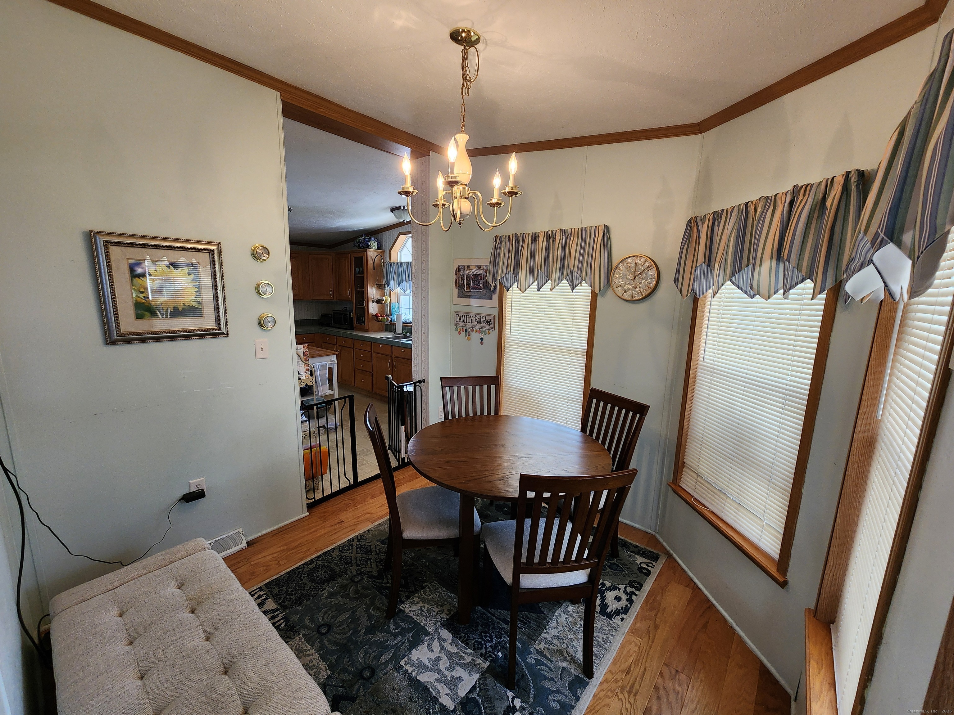 43 Evergreen Park Clinton, CT 06413 - Photo 10 of 43 a view of a dining room with furniture and wooden floor