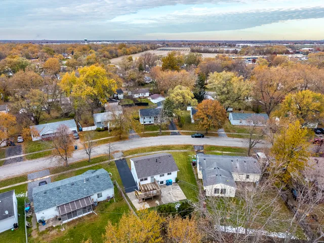 an aerial view of residential houses with outdoor space