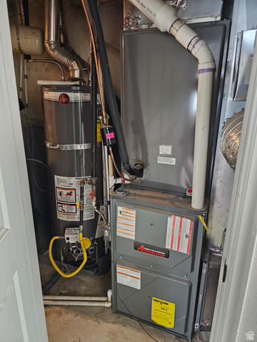 7481 Red Pine Road Eagle Mountain, UT 84005 - Photo 33 of 38 Utility closet featuring a water heater and furnace .