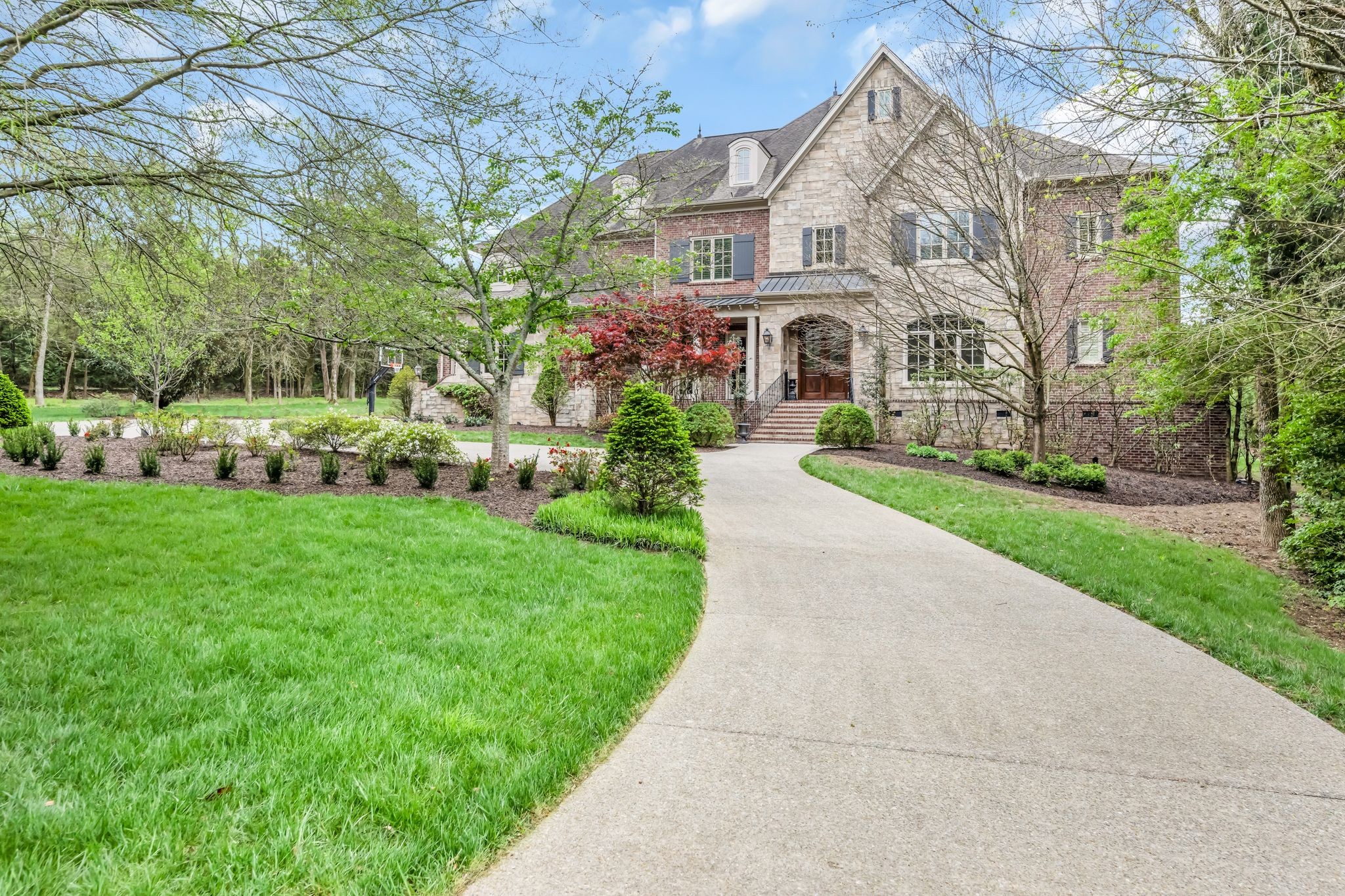 front view of a house with a yard