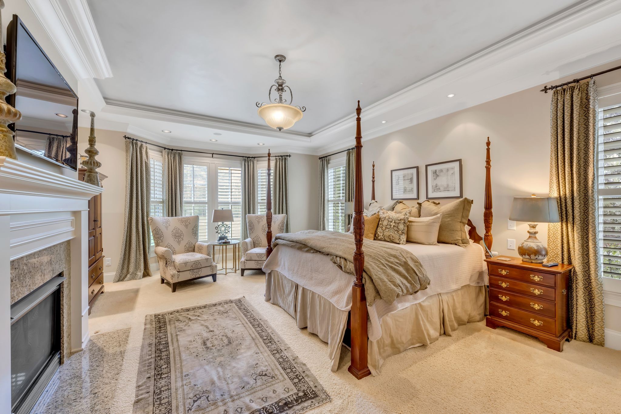 1191 Waterstone Boulevard Franklin, TN 37069 - Photo 17 of 32 a spacious bedroom with a bed a couch and dresser