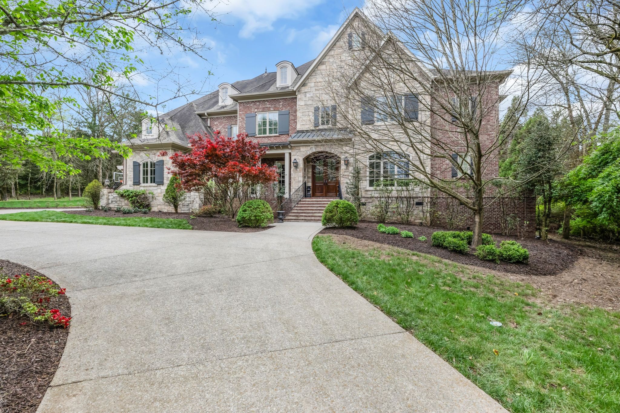 1191 Waterstone Boulevard Franklin, TN 37069 - Photo 2 of 32 a front view of house with yard and green space