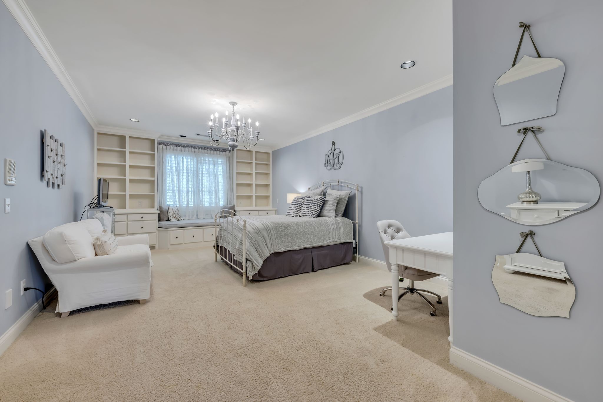 1191 Waterstone Boulevard Franklin, TN 37069 - Photo 22 of 32 a spacious bedroom with a bed and a chandelier