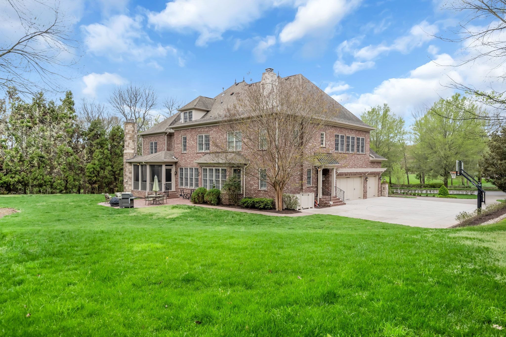 1191 Waterstone Boulevard Franklin, TN 37069 - Photo 32 of 32 a view of a house with a big yard and large trees