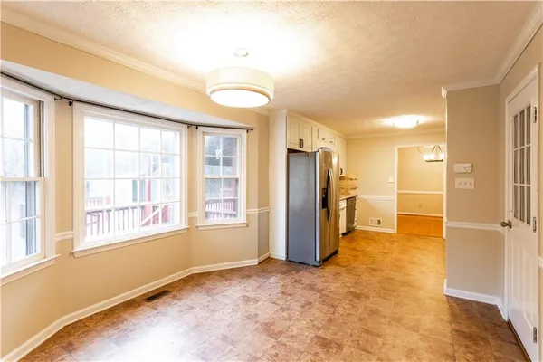 a view of a storage & utility room with a window