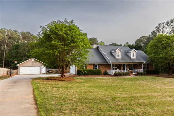 a front view of a house with garden