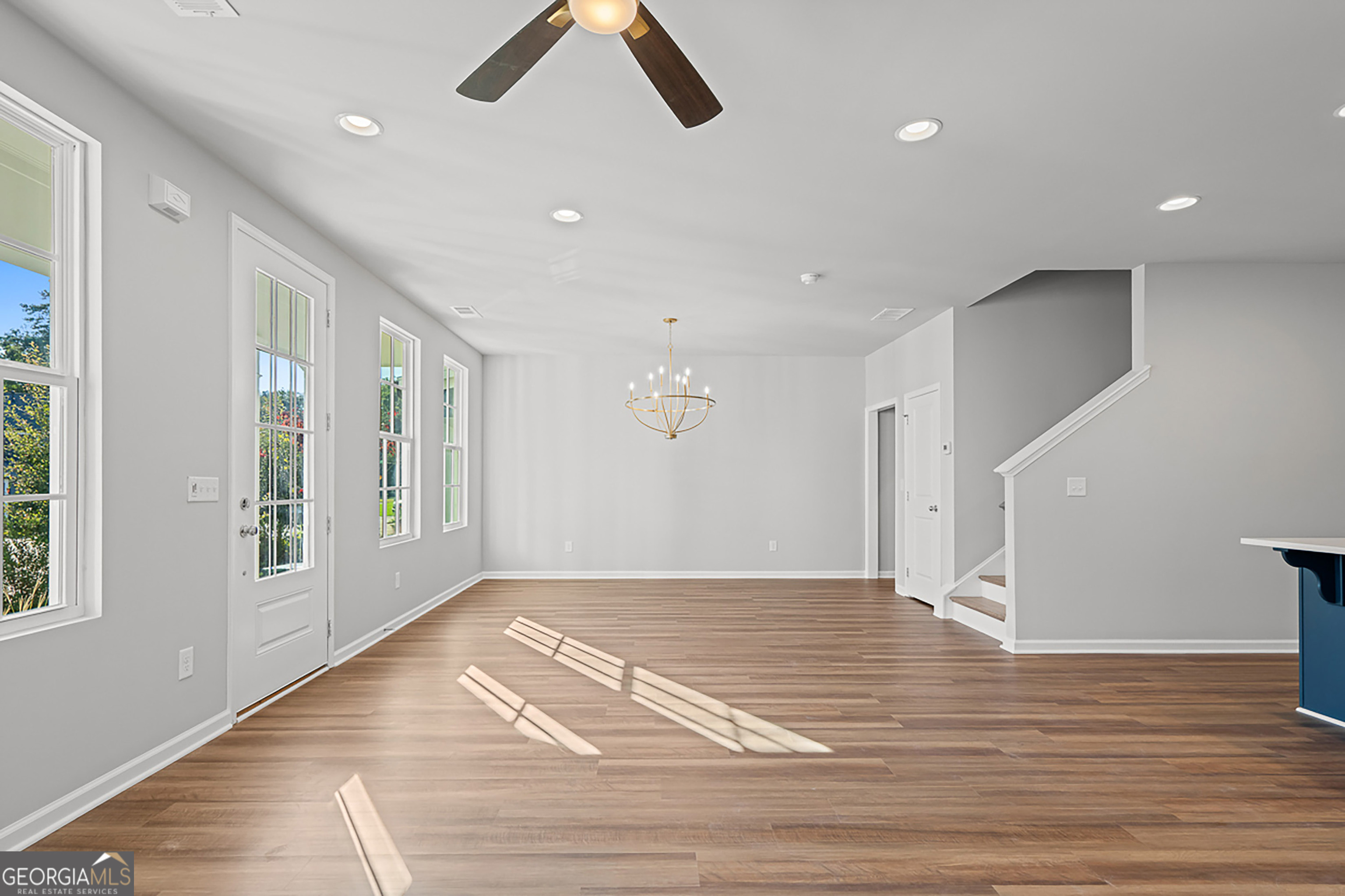 41 Hydrangea Lane, Unit 73 Auburn, GA 30011 - Photo 8 of 30 a view of an empty room with wooden floor and a window