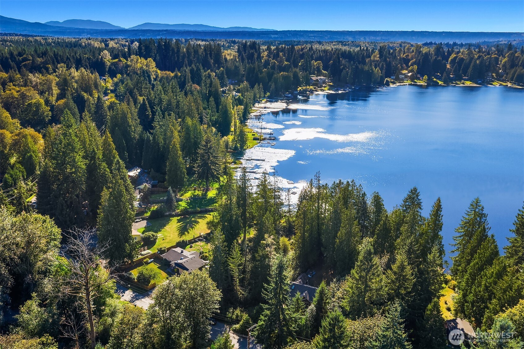 358-xx Northeast Moss Lake Road Carnation, WA 98014 - Photo 31 of 31 a view of a backyard of a house with a lake view