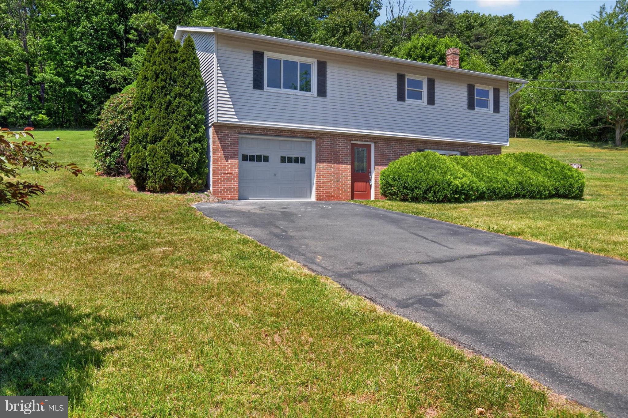 240 Harman Road Halifax, PA 17032 - Photo 3 of 31 Charming home with lush green surroundings.