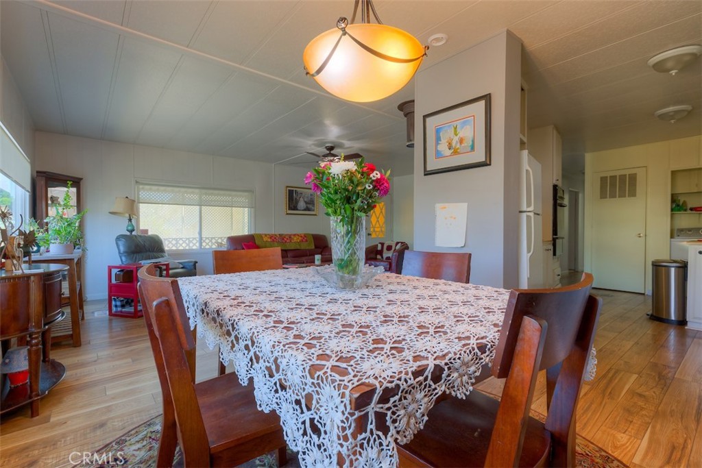 1901 Dayton Road, Unit 133 Chico, CA 95928 - Photo 10 of 36 a view of a dining room with furniture and wooden floor