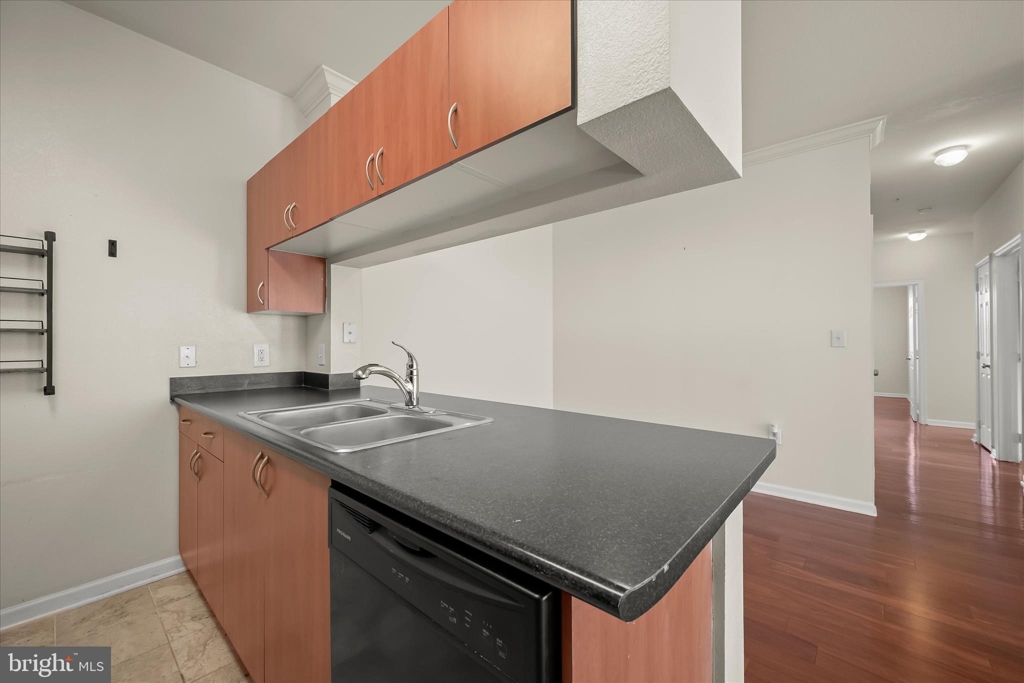 19620 Galway Bay Circle, Unit 302 Germantown, MD 20874 - Photo 14 of 36 a kitchen with a stove a sink and a refrigerator