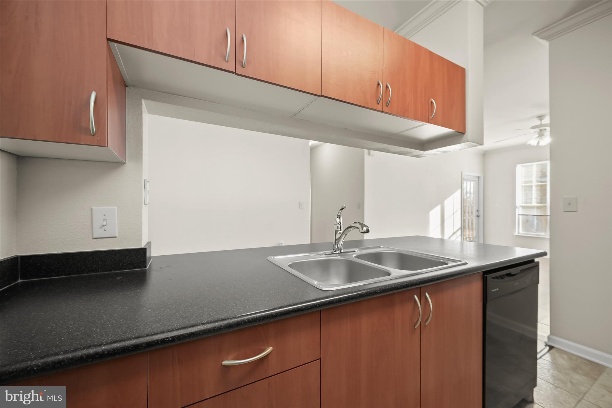 19620 Galway Bay Circle, Unit 302 Germantown, MD 20874 - Photo 15 of 36 a kitchen with a sink and cabinets