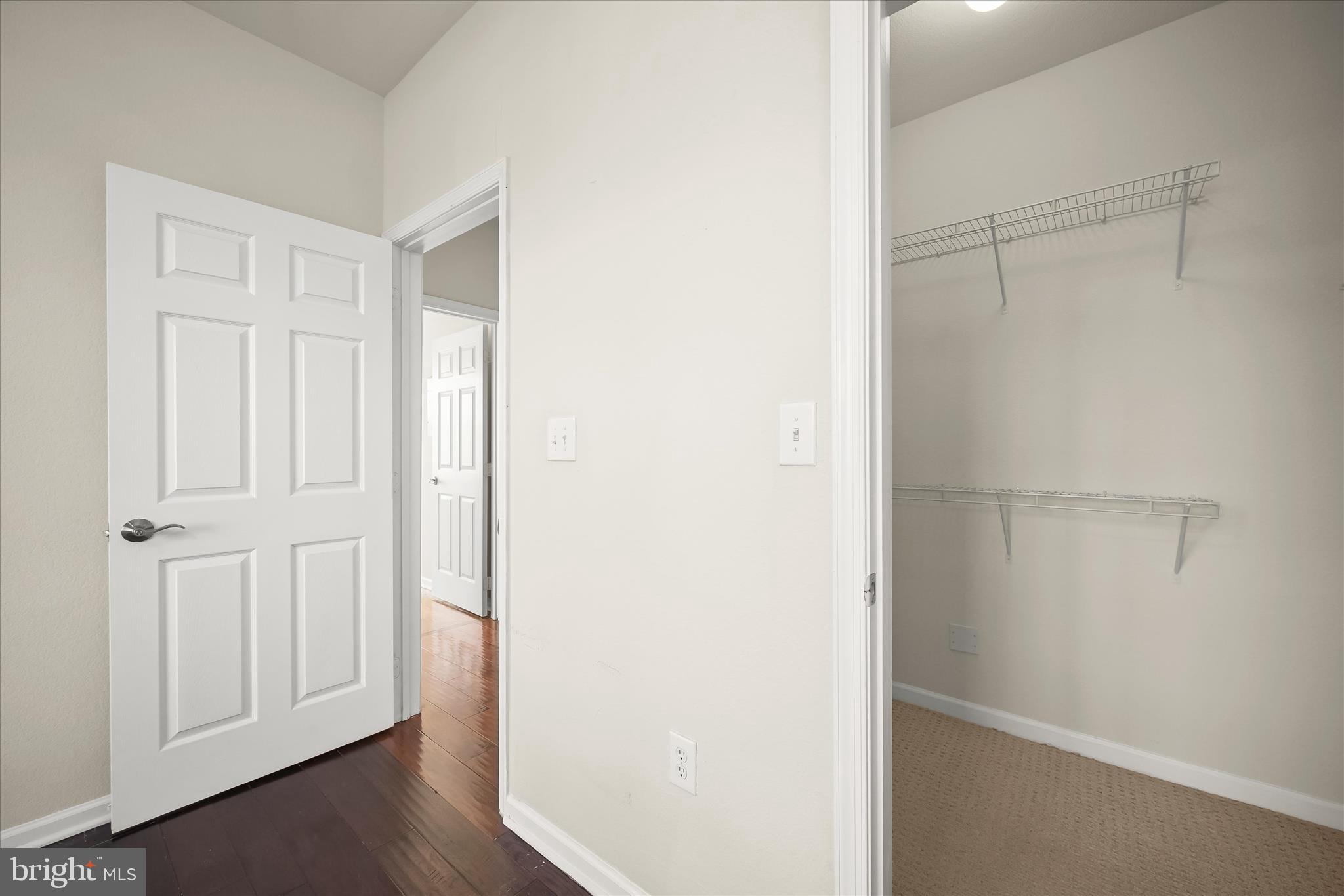 19620 Galway Bay Circle, Unit 302 Germantown, MD 20874 - Photo 22 of 36 a view of a closet area with hardwood floor