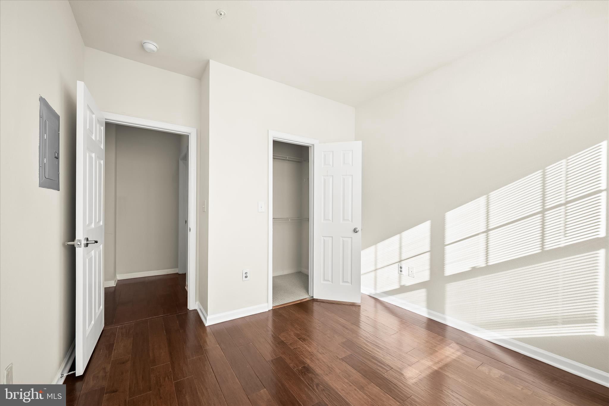 19620 Galway Bay Circle, Unit 302 Germantown, MD 20874 - Photo 26 of 36 a view of an empty room with wooden floor