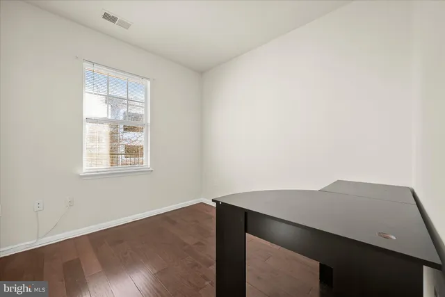 a bathroom with a sink a toilet a mirror and vanity