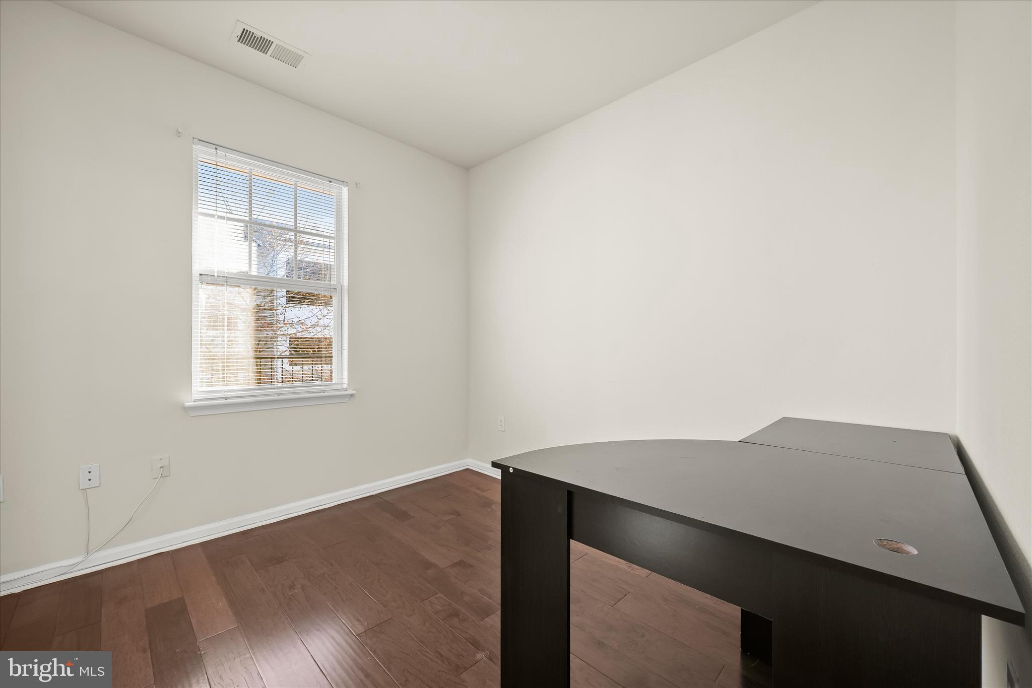 19620 Galway Bay Circle, Unit 302 Germantown, MD 20874 - Photo 29 of 36 wooden floor in an empty room