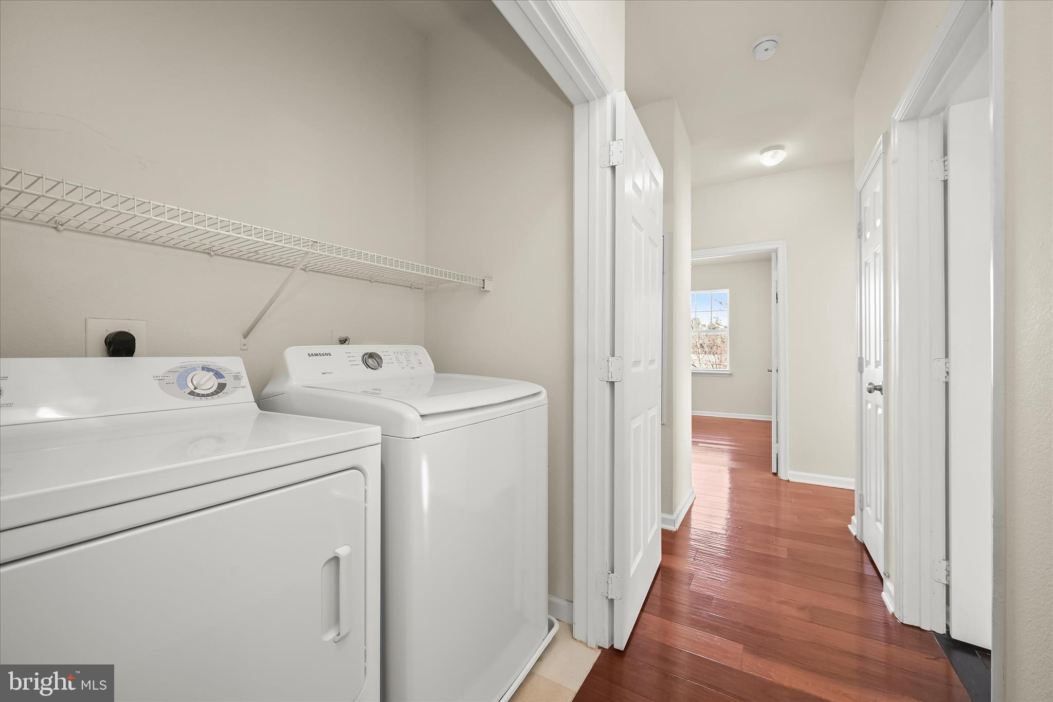 19620 Galway Bay Circle, Unit 302 Germantown, MD 20874 - Photo 32 of 36 a view of utility room with washer and dryer